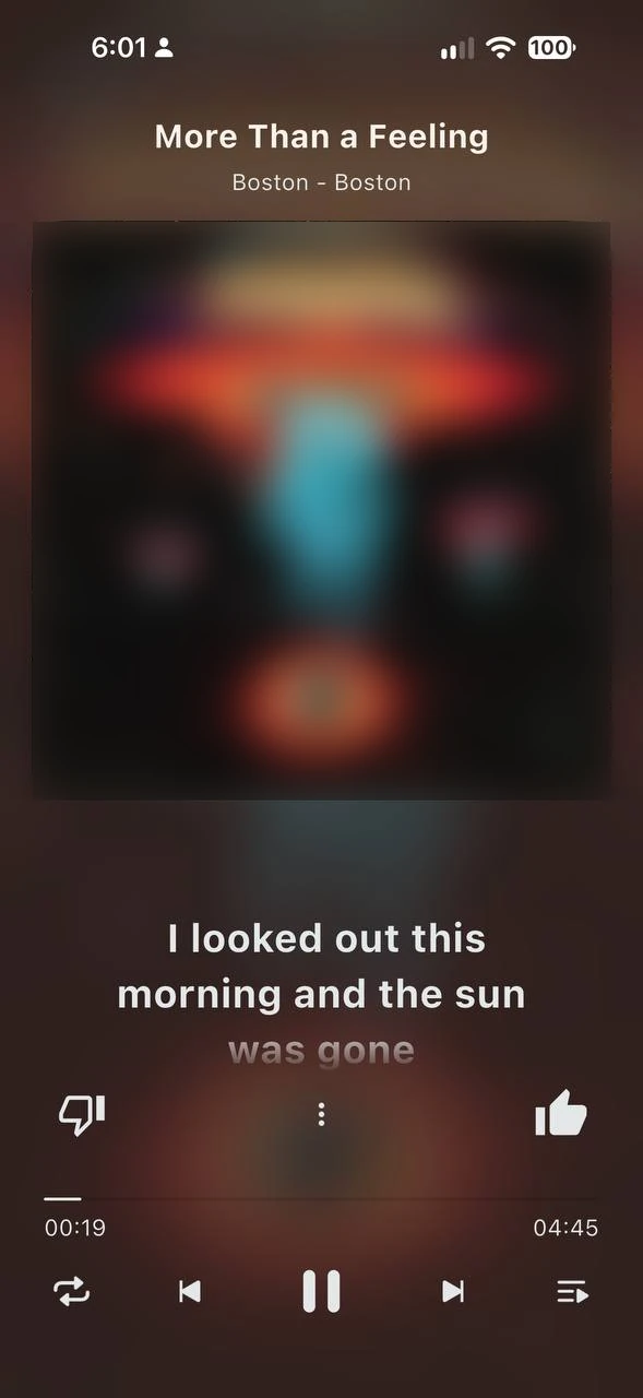 Now Playing with synced lyrics scrolling under the album artwork